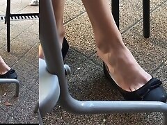 Cute girlfriend barefoot dangling in balerinas